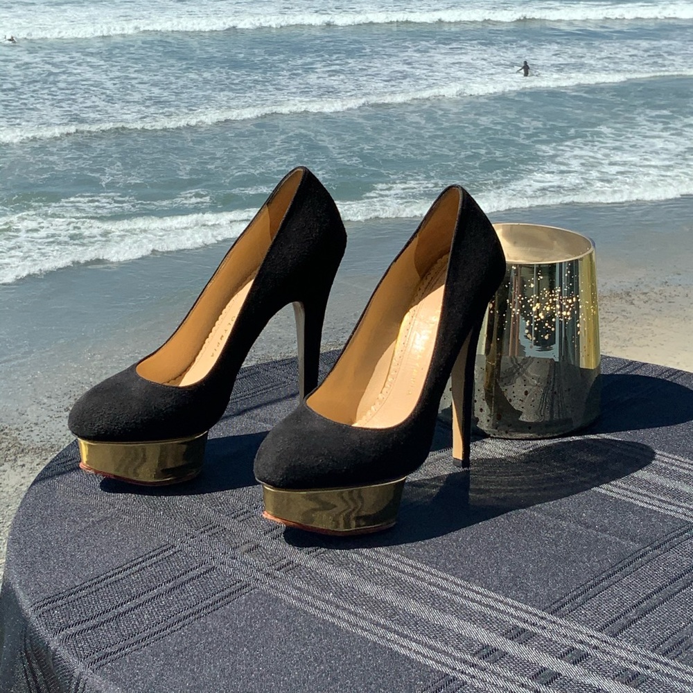 Charlotte Olympia “Dolly” Black/Gold Suede Pump.